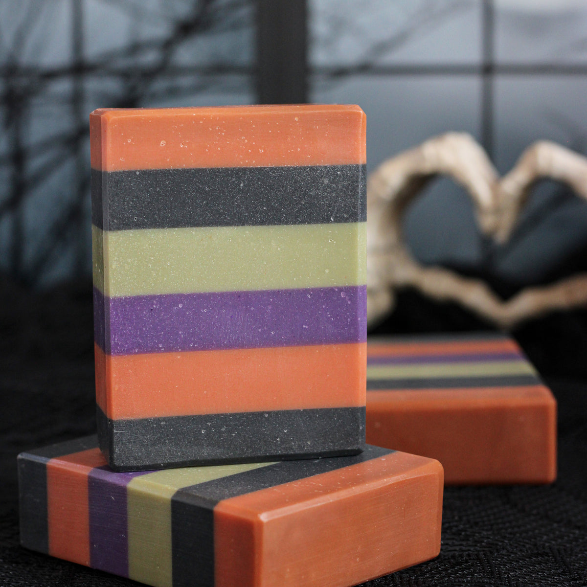 Trick or Treat handmade soap with bold orange, black, green, and purple Halloween layers