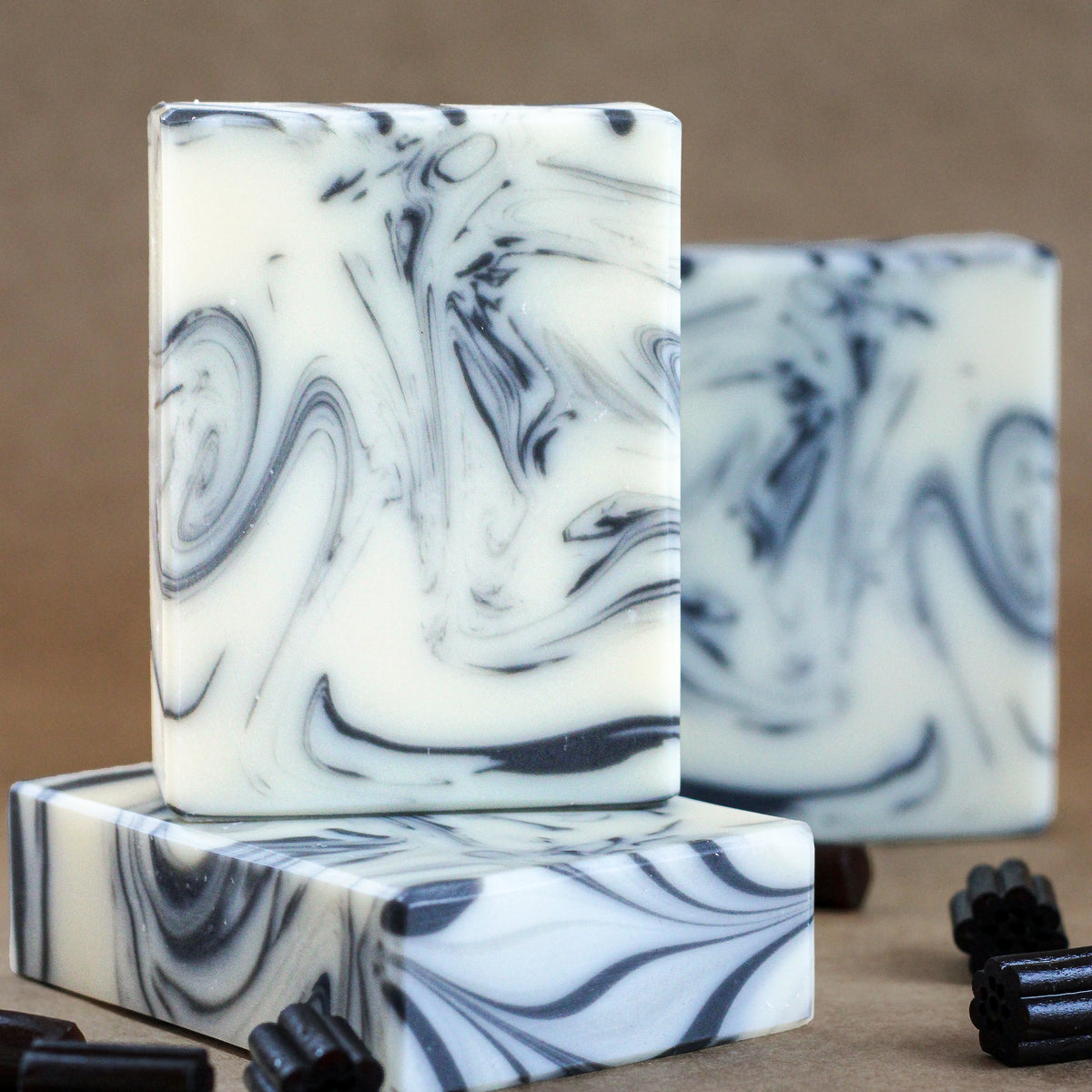 Anise Essential Oil Soap with black and white swirls on a kraft background with licorice 