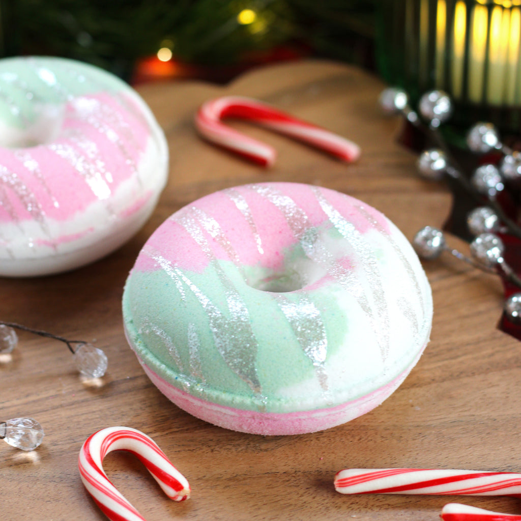 Missouri River Soap Buttermint Bath Bomb – donut-shaped bath bomb in white with pink and green swirls; refreshing scent of cool top notes, mint, and vanilla.