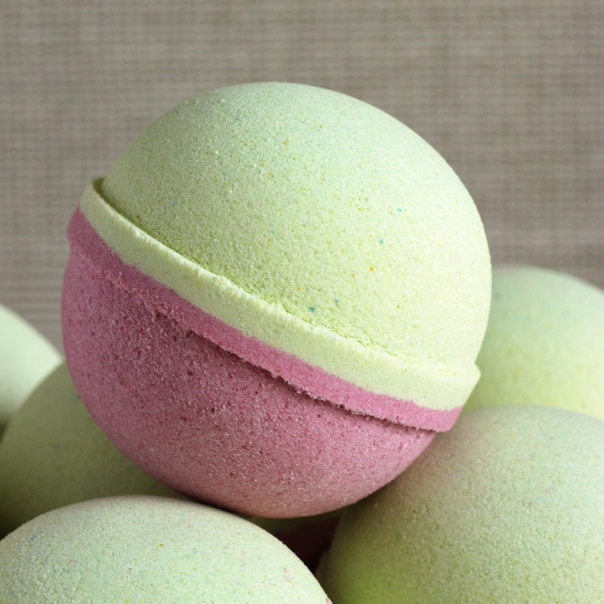 Pink and lime green Cranberry Limeade bath bomb handcrafted by Missouri River Soap
