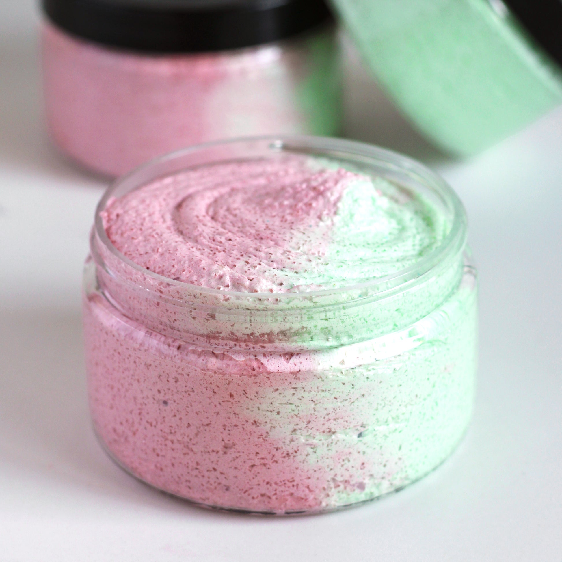 Missouri River Soap Cranberry Limeade Whipped Soap Sugar Scrub in a 4 oz clear jar with one half pink scrub and one half green scrub
