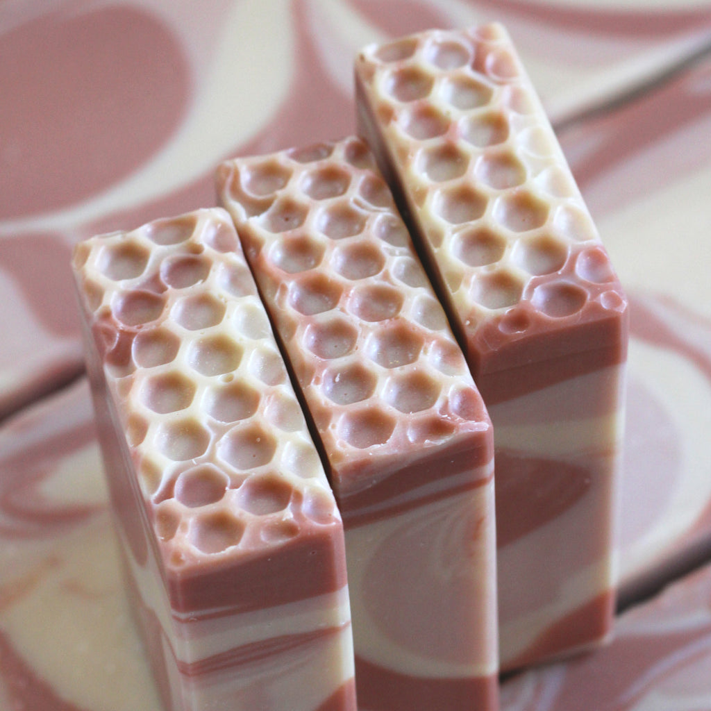 Three bars of soap with honeycomb pattern 