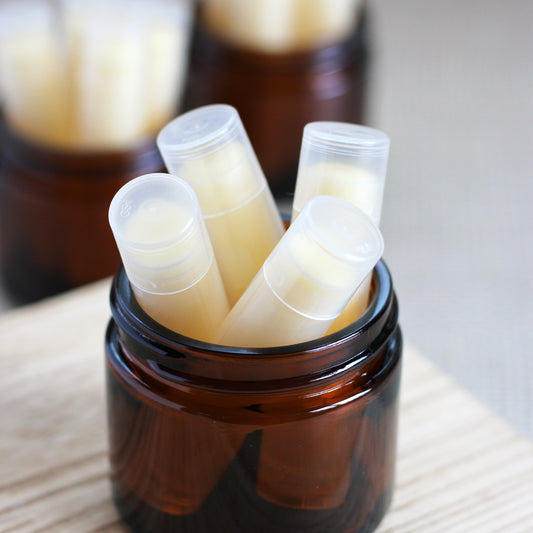 An amber jar with lip balm tubes