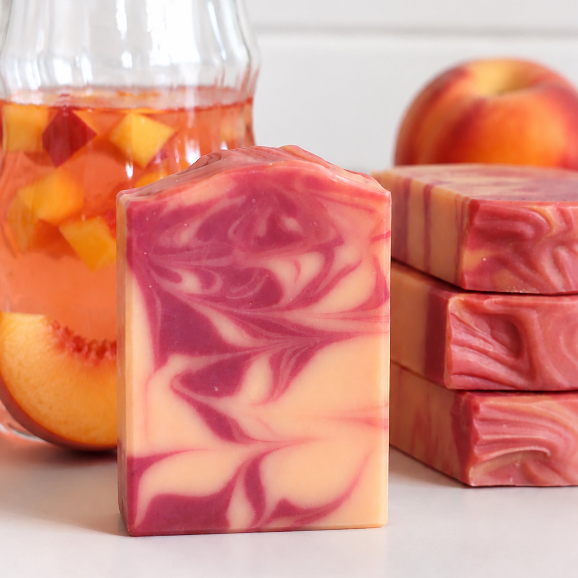 Peach Mango Sangria handmade cold process soap with vibrant peach, coral, and peachy-colored swirls by Missouri River Soap
