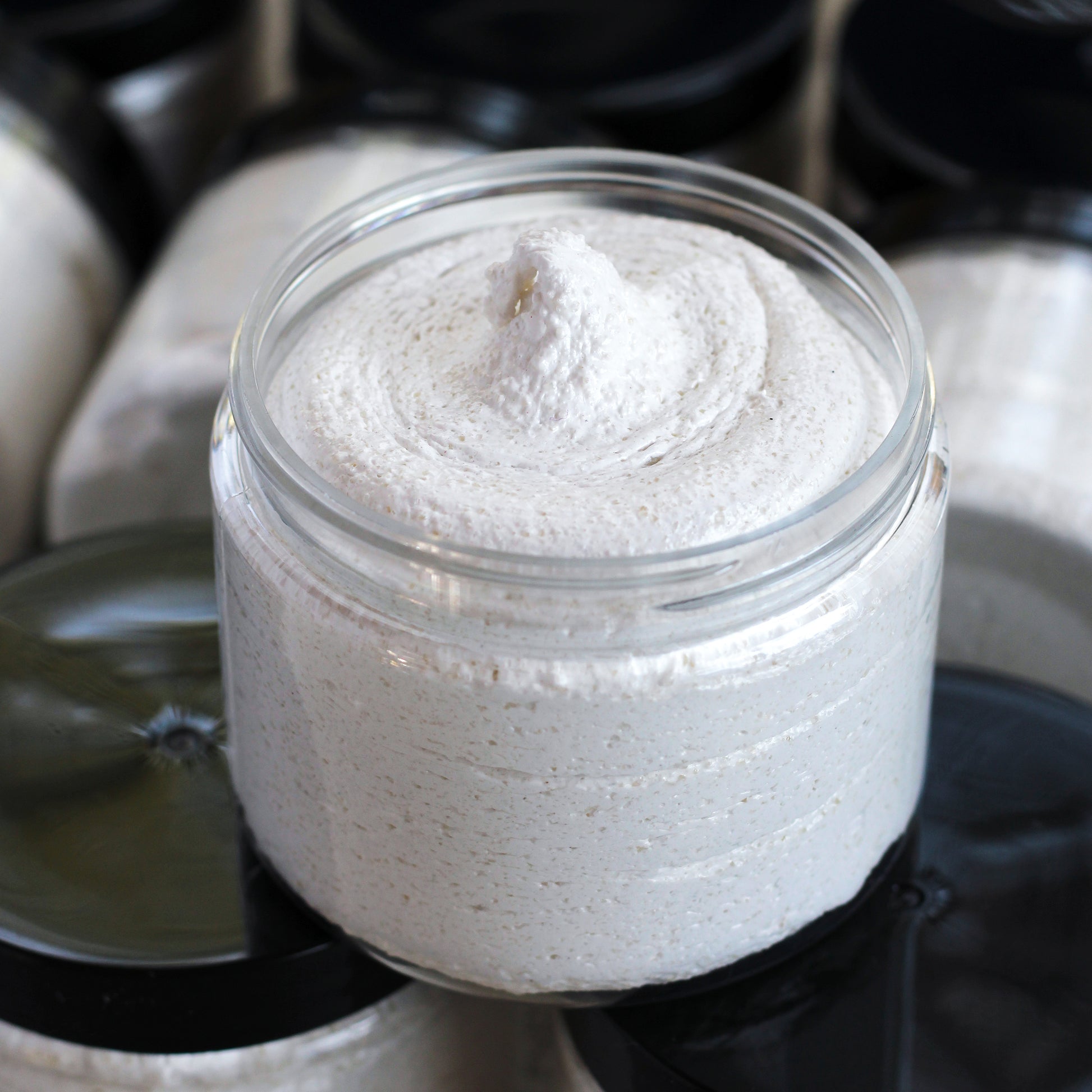 Jar of creamy colored scrub