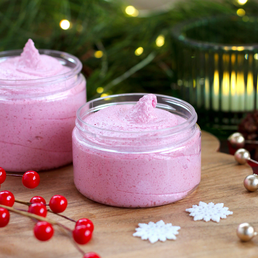 Missouri River Soap Snow Kissed Whipped Sugar Scrub – festive whipped sugar scrub swirled in two shades of pink; scented with candied apple, orange zest, warm spice, and earthy undertones.