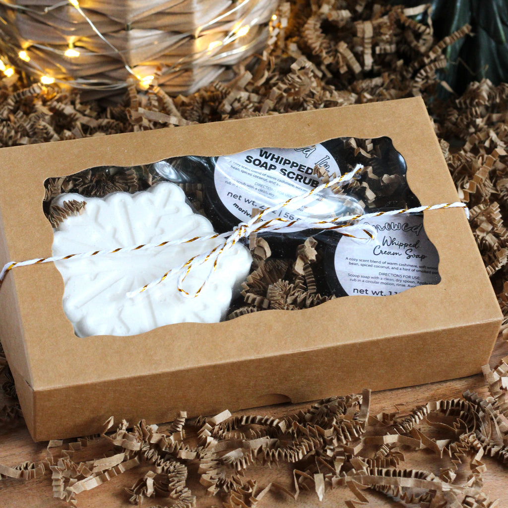 Three Snowed In Products in a box tied with a string.